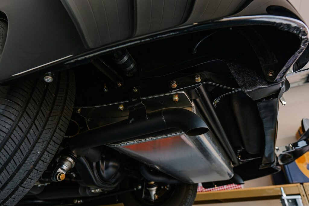 Exhaust system on the underside of a car
